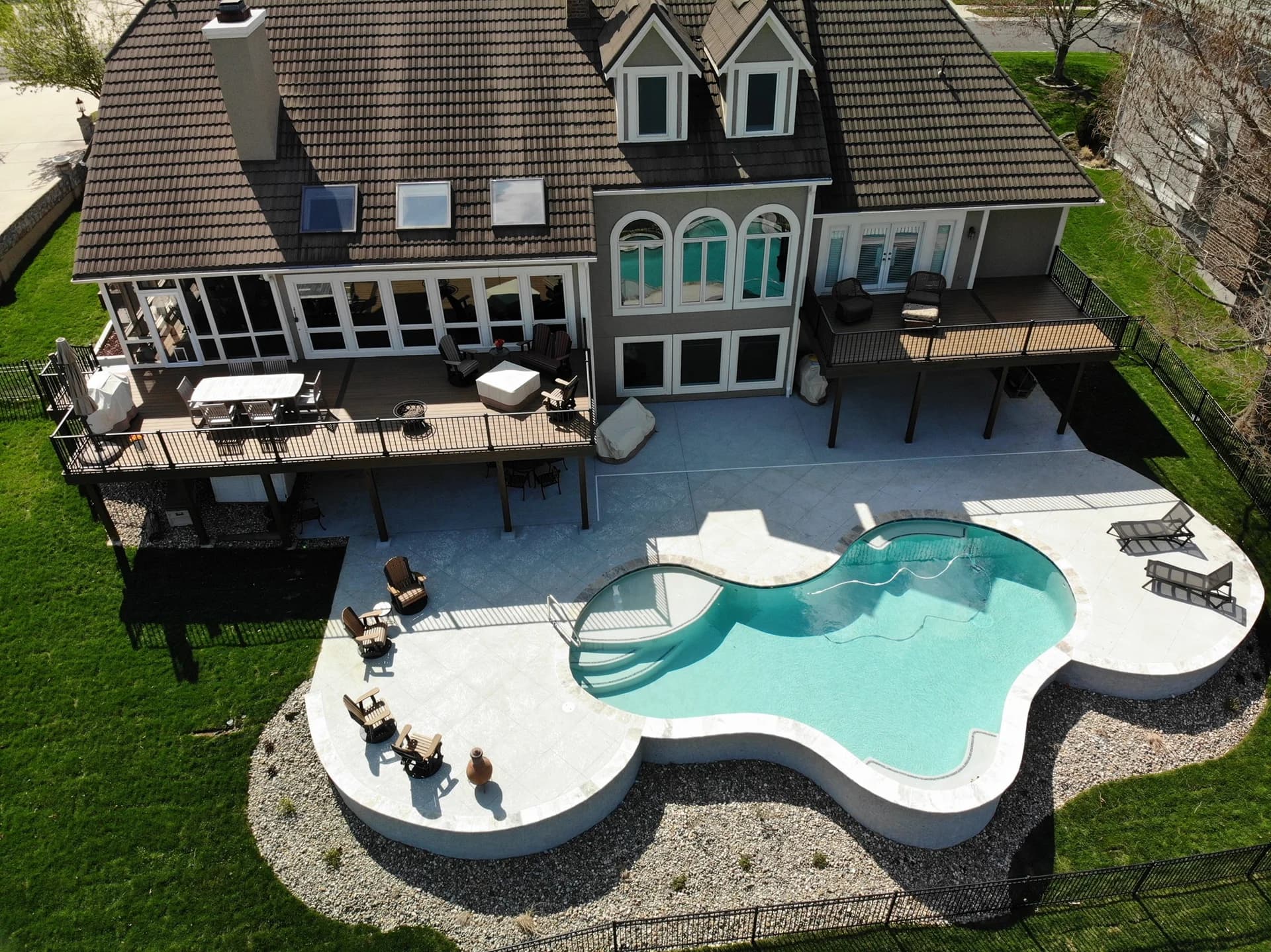 Completed multi-level composite deck with aluminum railing in Mesquite.