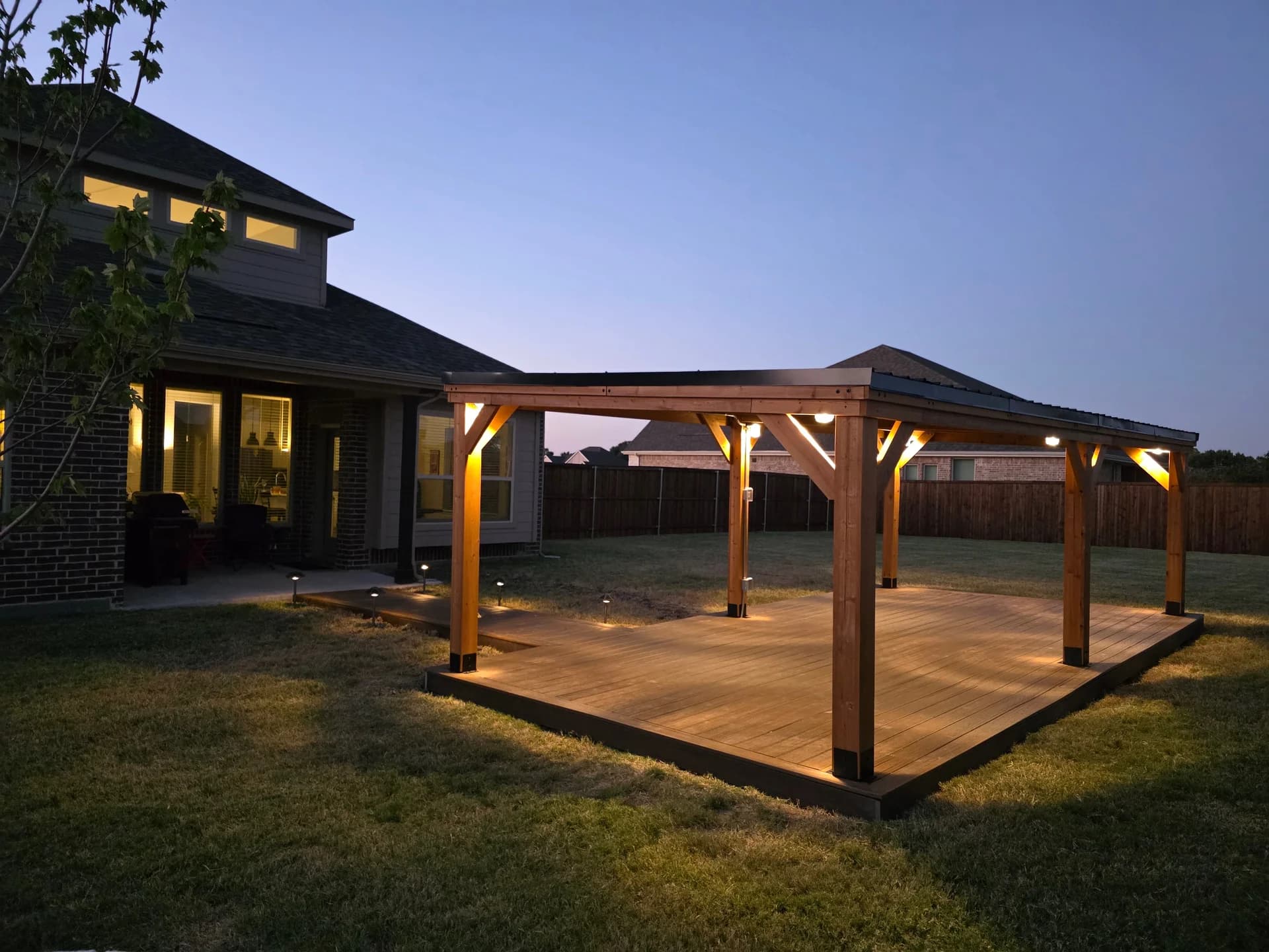 Custom cedar pergola with lighting built by i30 Builders