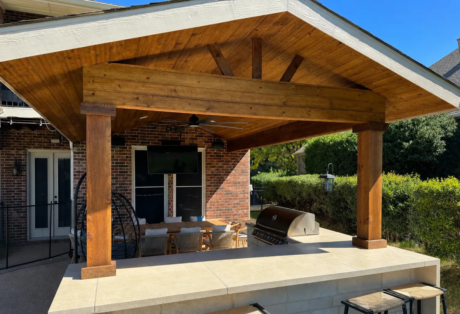 Cedar patio cover over a new-construction backyard in Royse City, TX by i30 Builders