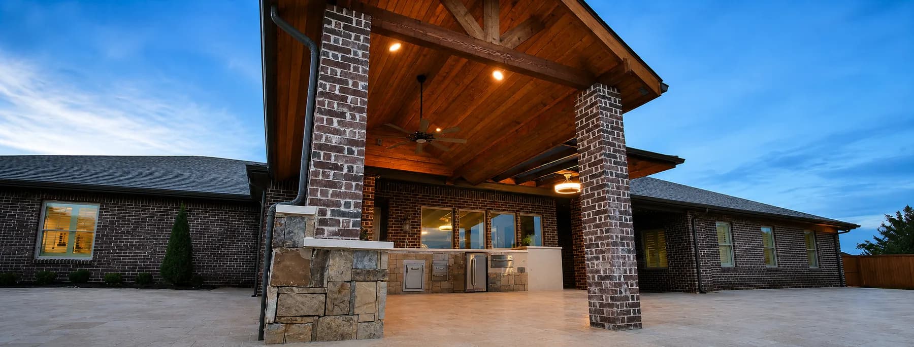 Cedar pergola over a patio in a McKinney, TX backyard by i30 Builders